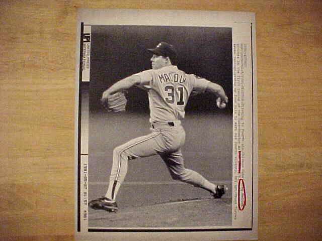 WIREPHOTO: Greg Maddux - [05/07/91] 'Bearing Down' (Cubs) Baseball cards value