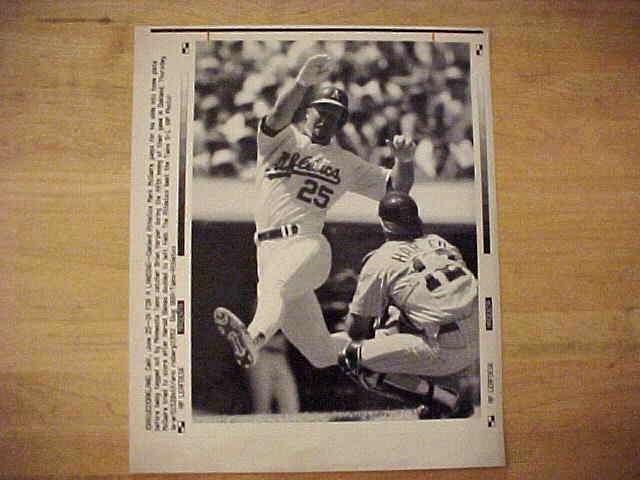 WIREPHOTO: Mark McGwire - {06/25/92} 'In For A Landing' (Athletics) Baseball cards value