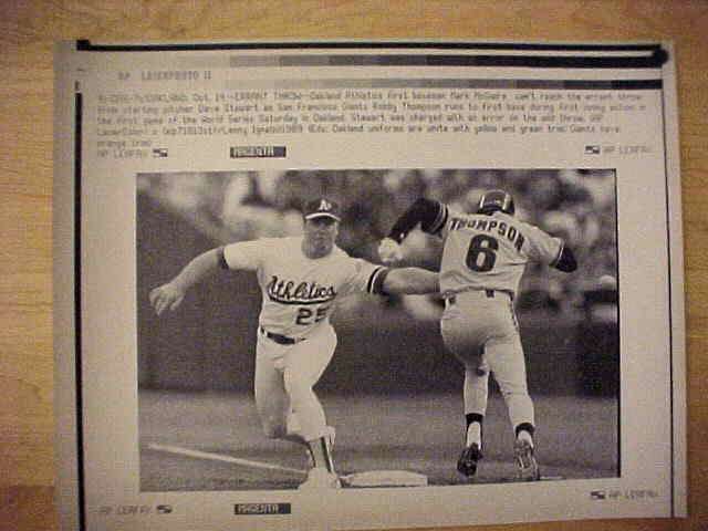 WIREPHOTO: Mark McGwire - {10/14/89} 'Errant Throw' (Athletics) Baseball cards value