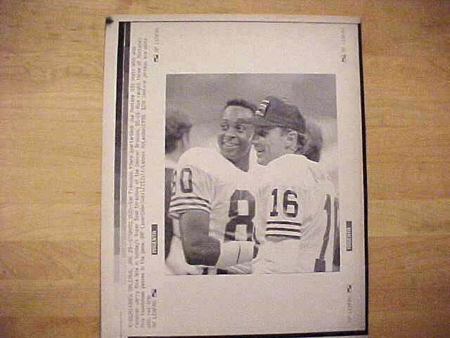 WIREPHOTO: Joe Montana - [01/29/90] 'Dynamic Duo' (49ers) Football cards value