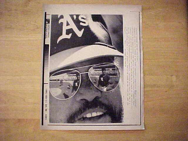 WIREPHOTO: Reggie Jackson - [03/11/91] 'Mirror Image' (A's) Baseball cards value