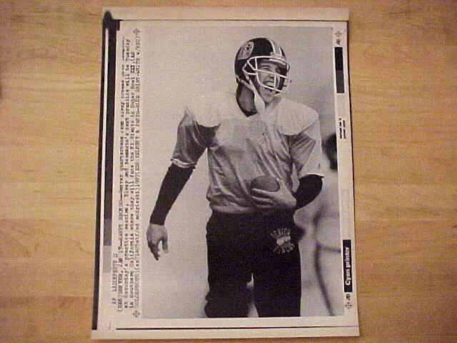 WIREPHOTO: John Elway - [01/17/87] 'Happy Bronco' (Broncos) Football cards value