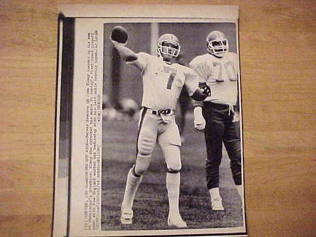 WIREPHOTO: John Elway - {01/08/87} 'Wounded But Able' (Broncos) Football cards value