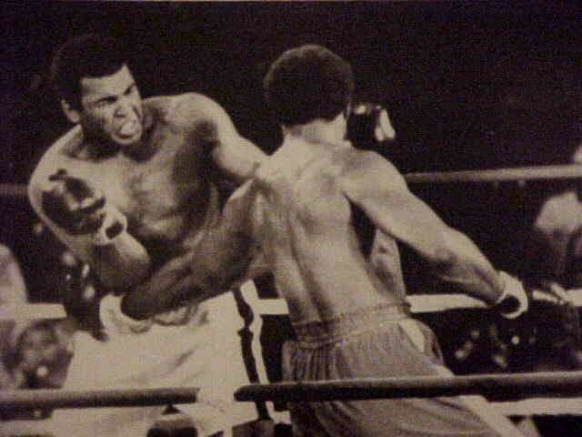 WIREPHOTO {Boxing}: Muhammad Ali - {10/30/74} 'Ouch!!' Boxing cards
