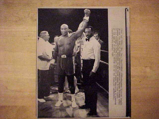 WIREPHOTO [BOXING]: George Foreman - [12/18/87] 'Foreman Wins' Baseball cards value