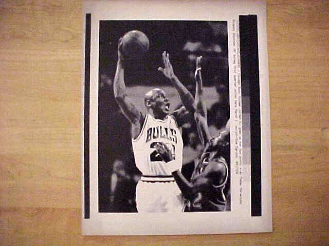 WIREPHOTO: Michael Jordan - [03/01/91] 'Up And Over' (Bulls) Baseball cards value