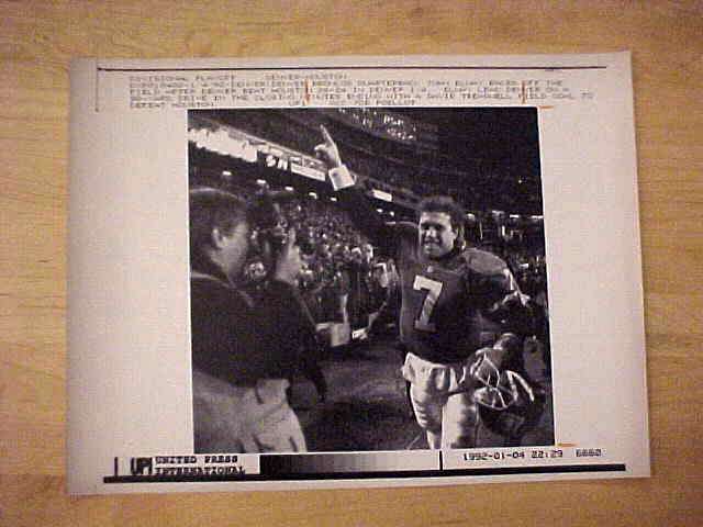 WIREPHOTO: John Elway - [01/04/92] 'Divisional Winner' (Broncos) Football cards value