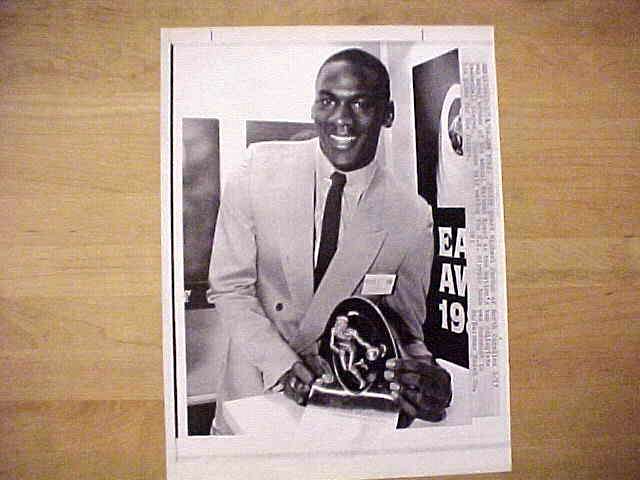 WIREPHOTO: Michael Jordan - [03/27/84] 'Awards Time' (Bulls) Basketball cards value