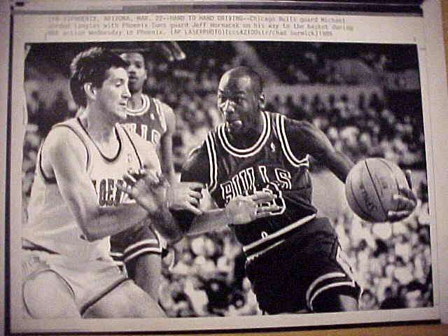 WIREPHOTO: Michael Jordan - [03/22/89] 'Hand To Hand Driving' (Bulls) Basketball cards value