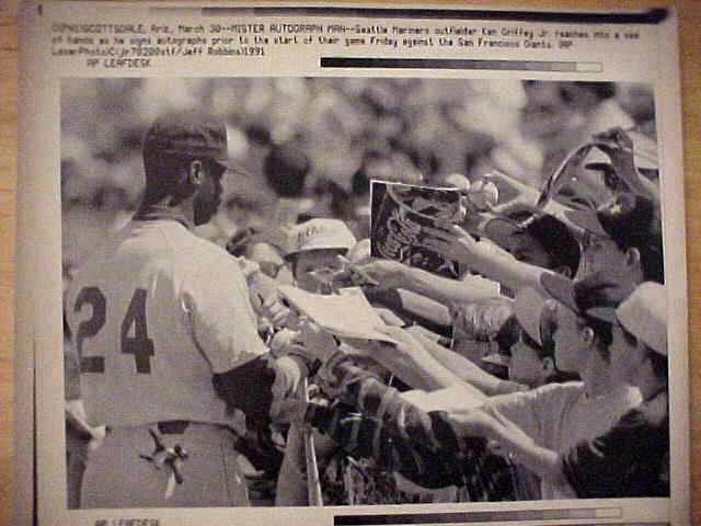 WIREPHOTO: Ken Griffey Jr - [03/30/91] 'Mister Autograph Man' (Mariners)  cards value