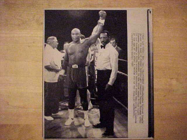WIREPHOTO [BOXING]: George Foreman - [12/18/87] 'Foreman Wins'  cards value